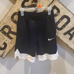 Nike Dri-Fit Boys size medium black with white trim basketball shorts.